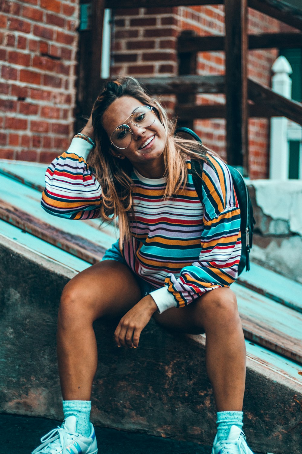 woman sitting on wood