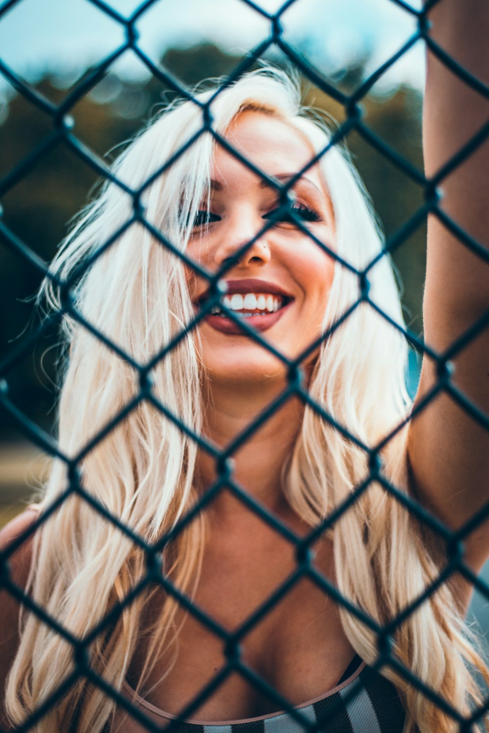 smiling woman wearing grey shirt