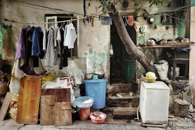 white top-load washing machine near doorsteps