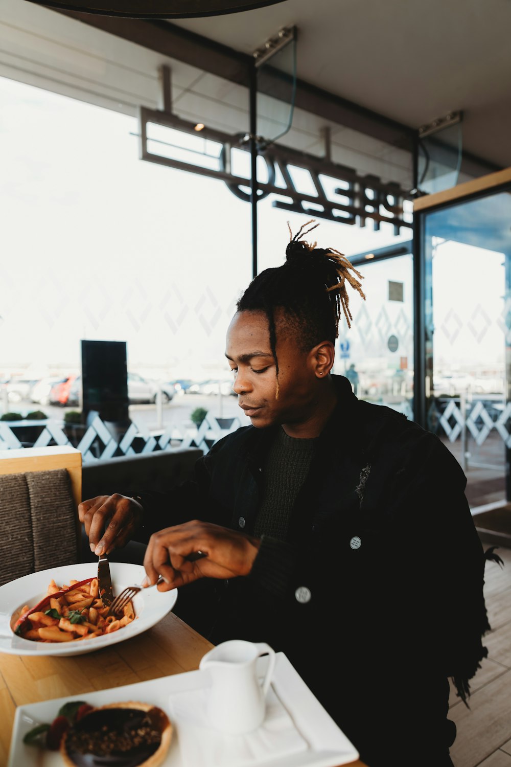 man holding knife and fork