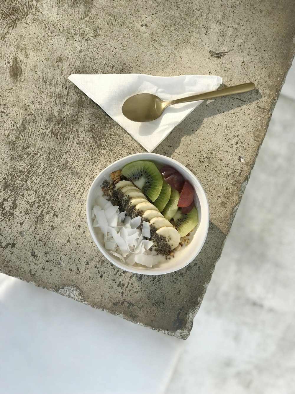 sliced fruits in white ceramic bowl