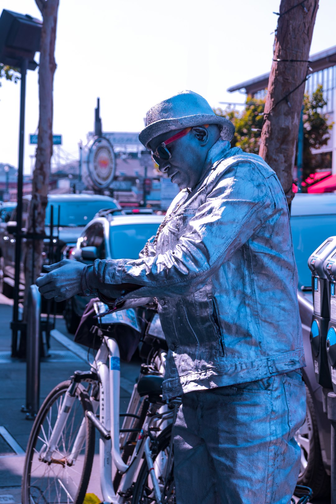 man performing robotic acts near bicycle on focus photography