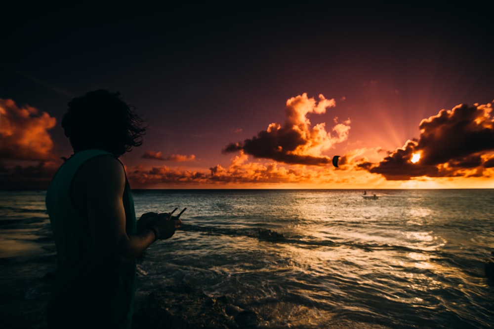 person standing in front of sea