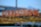 A blurred image with out-of-focus lights forming the words 'FOOD & DRINK' in a bokeh style. The background is soft, with hints of a blue sky and some structural elements possibly from a building.