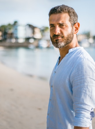 man standing on beach during daytime