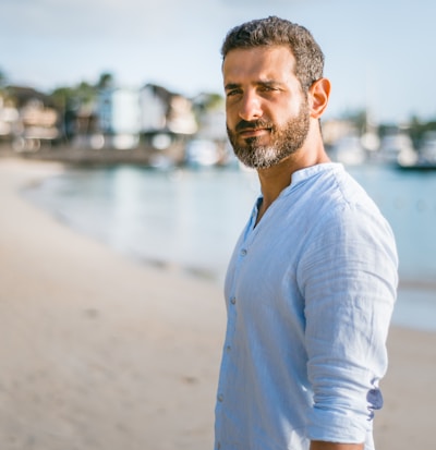 man standing on beach during daytime