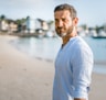 man standing on beach during daytime