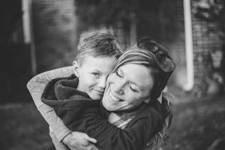 boy hugging woman