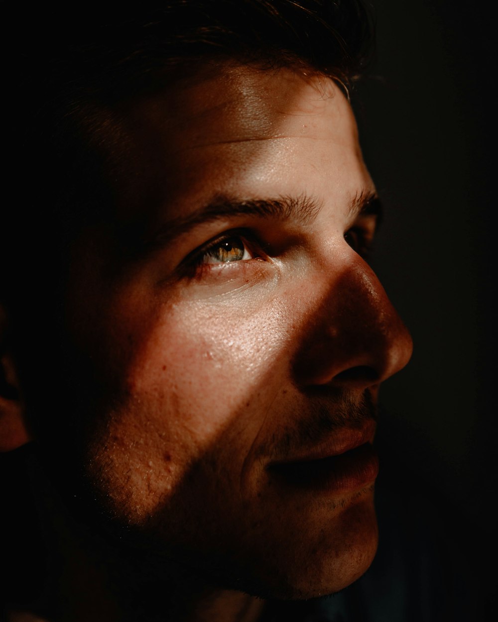 focus photography of man looking up