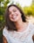 woman smiling wearing white top