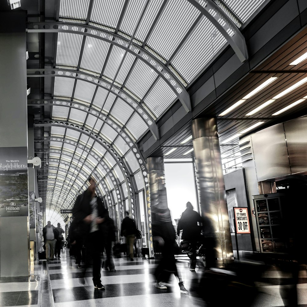 time lapse photography of people walking inside a building