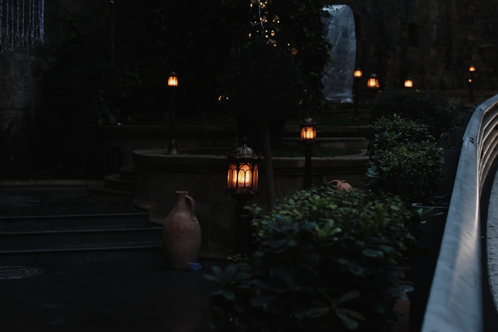 brown stoneware jug beside lantern lamp