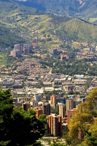 city with high-rise buildings near mountain view