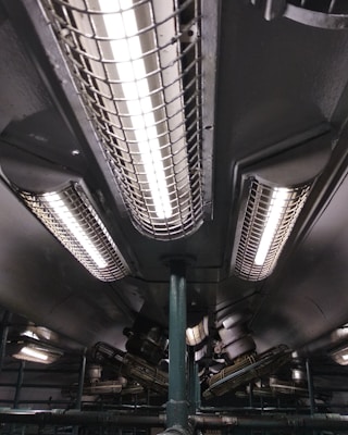 Industrial lighting systems installed in a warehouse setting.