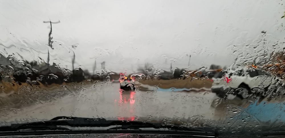 vehicle running on road during rainy