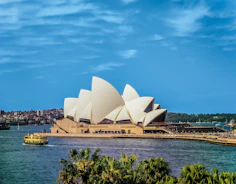 yellow boat near Sydney Opera, Australia during daytime