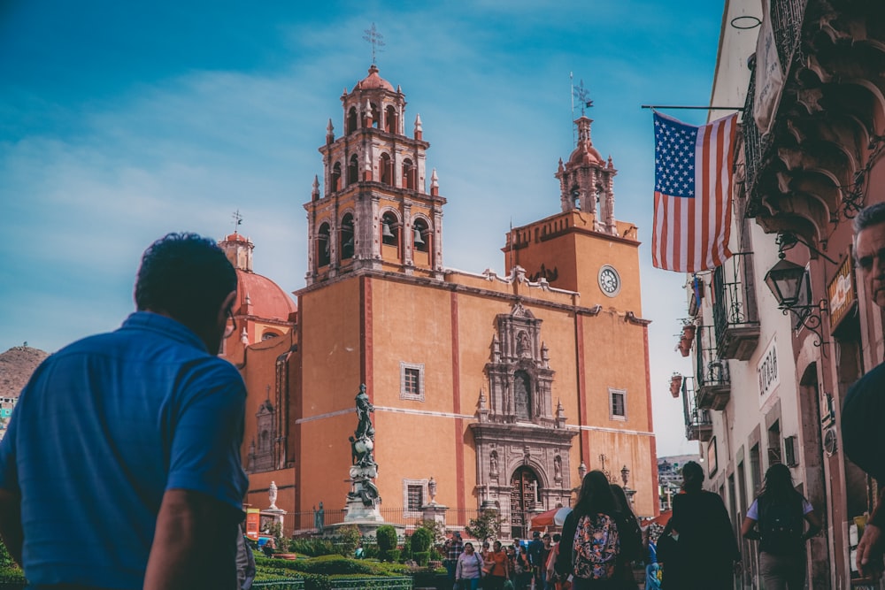 man standing near church