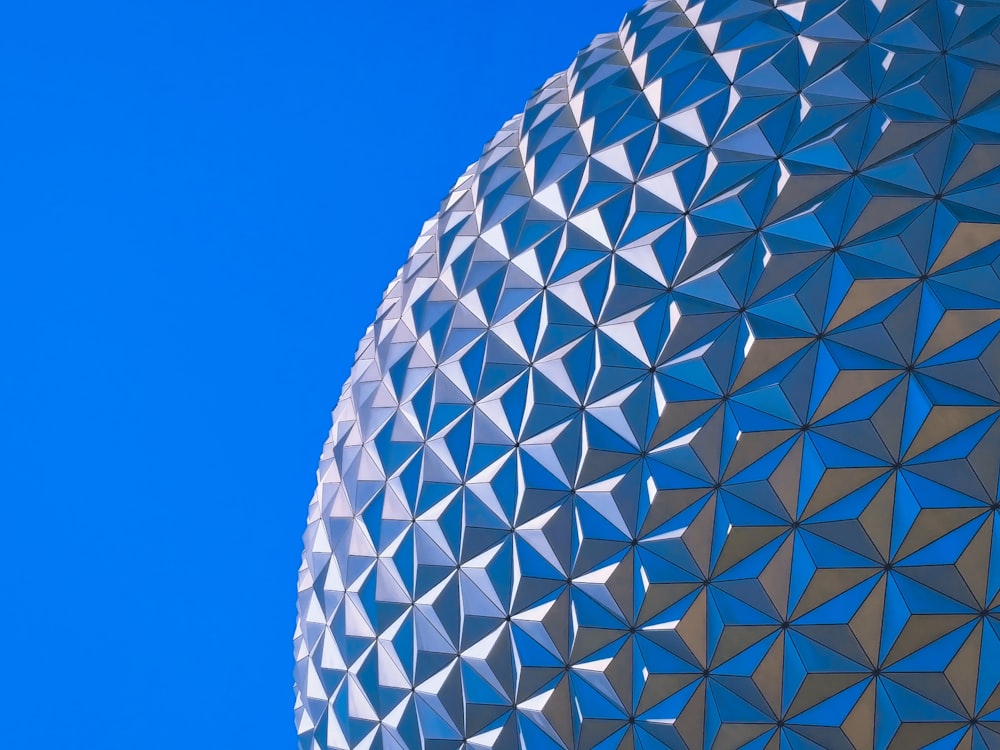 close-up photography of round silver building