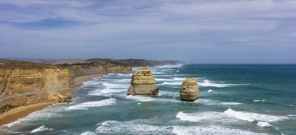 two sea stacks during daytime