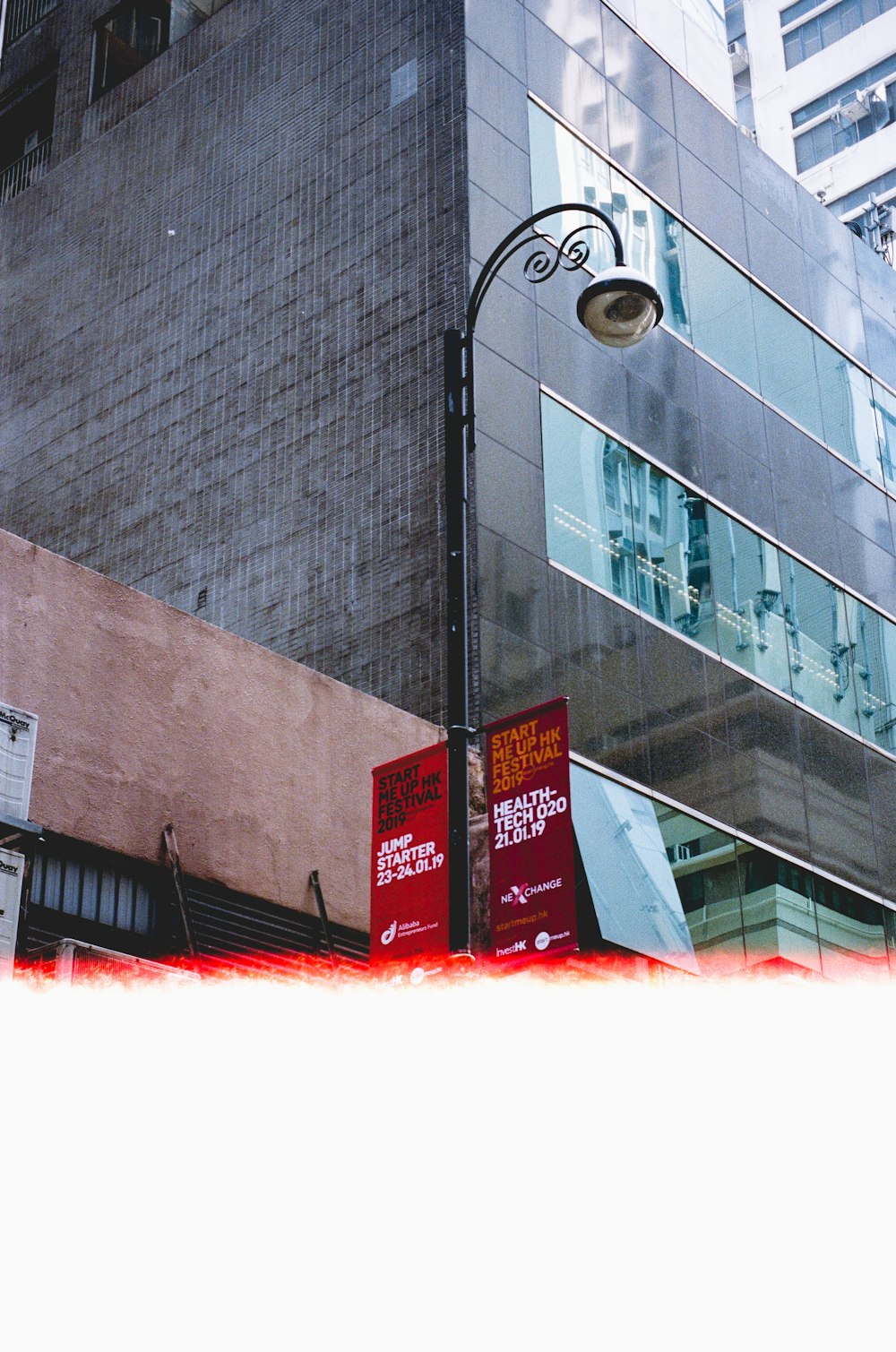 black metal post light beside concrete building during daytime