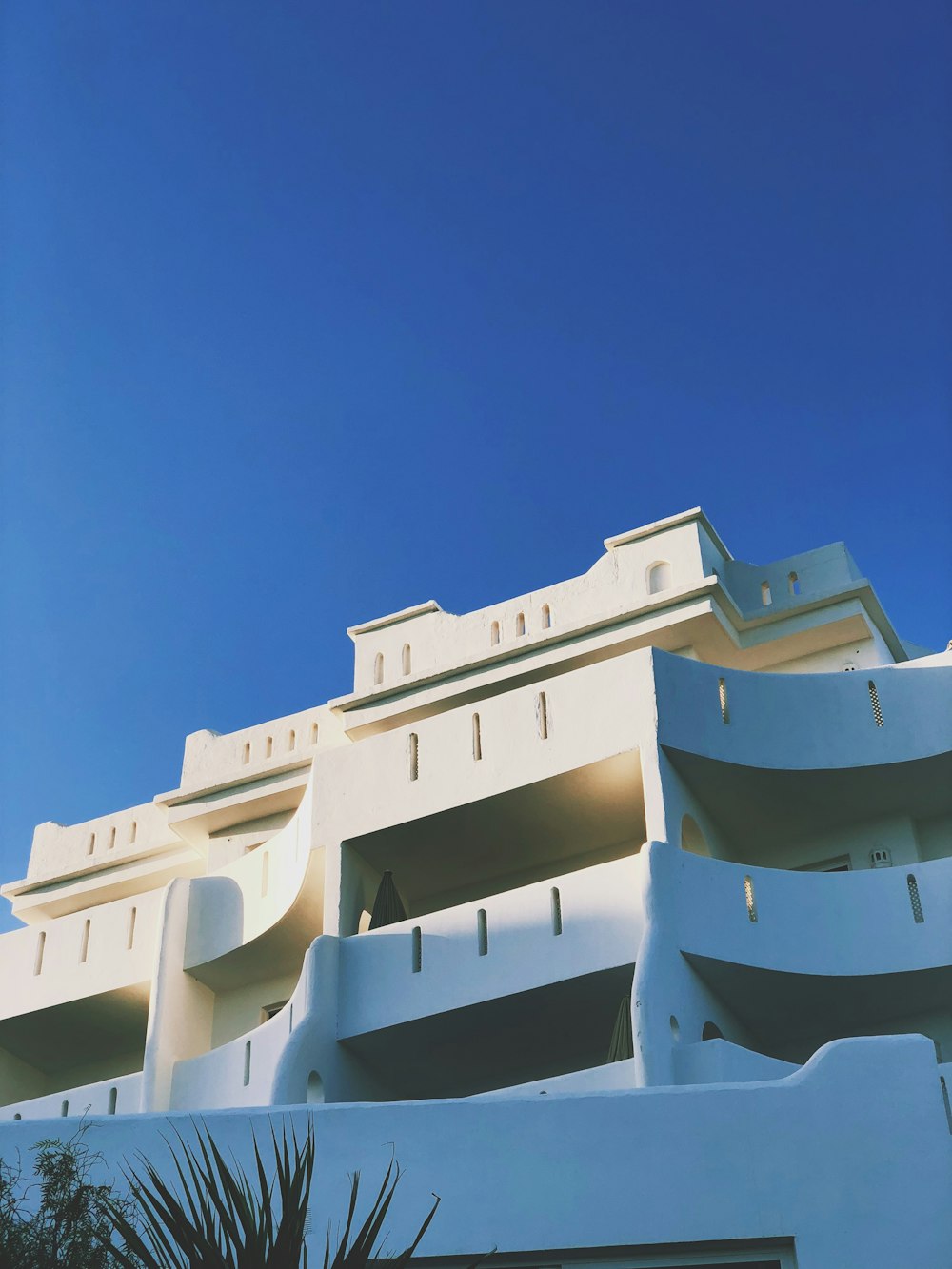 white concrete building under blue sky