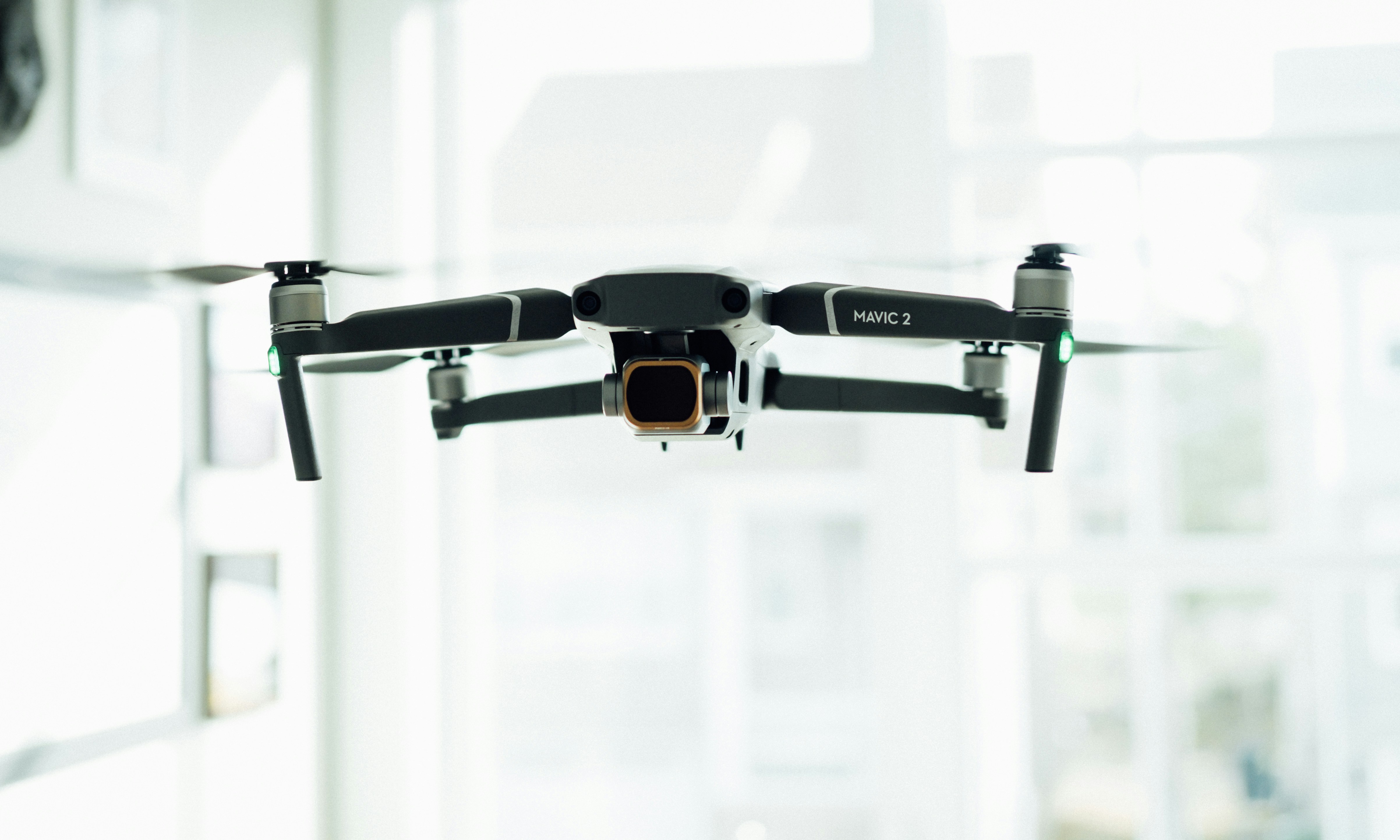 flying black quadcopter drone