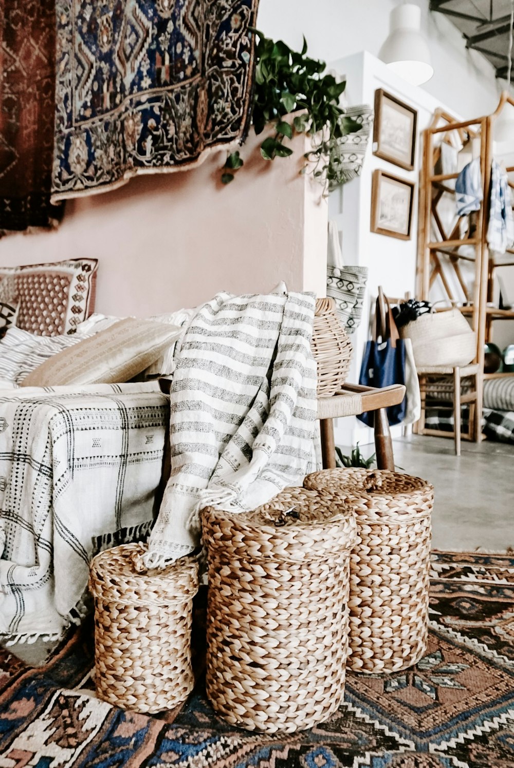 empty sofa with three woven nesting baskets