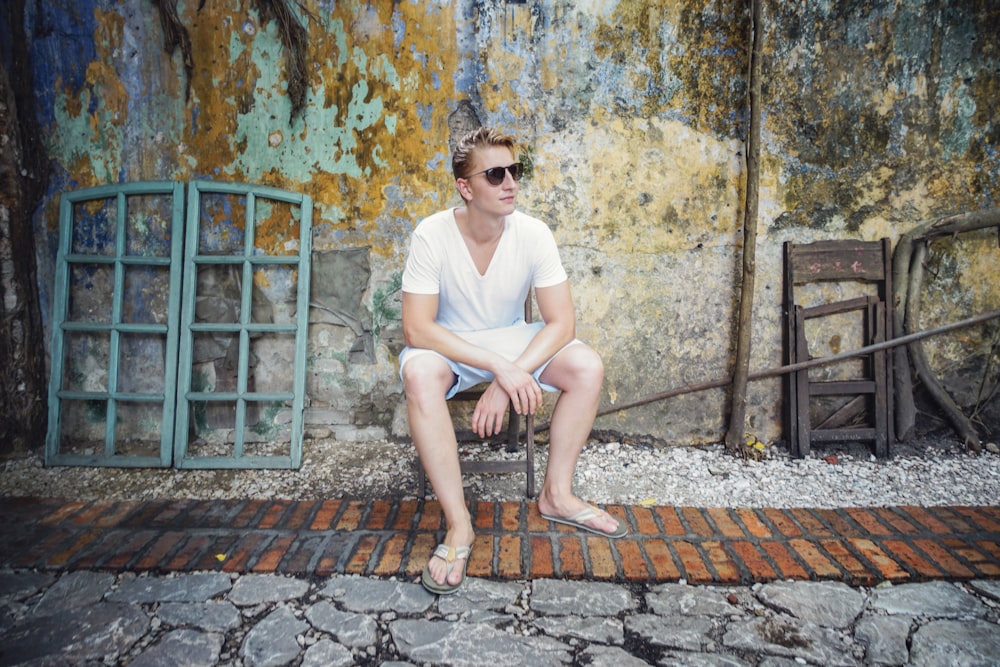 man sitting on stool