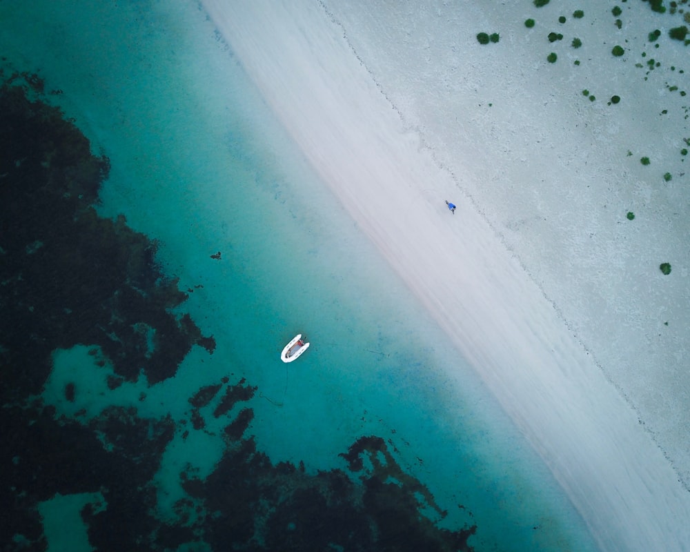 boat on ocean in aerial photography