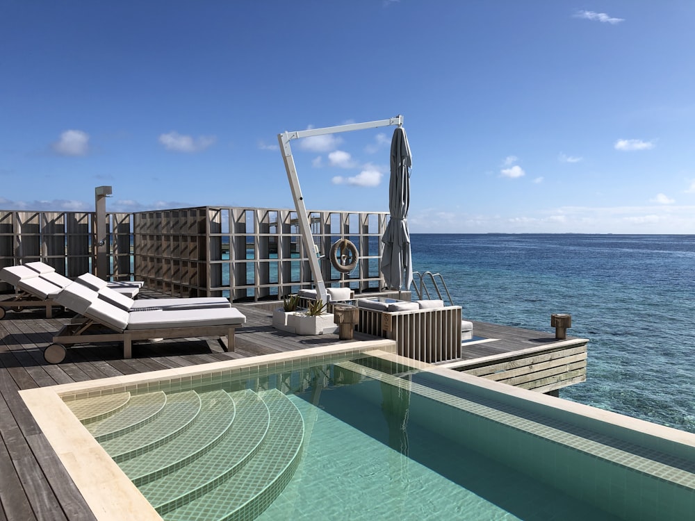 empty pool beside beach at daytime