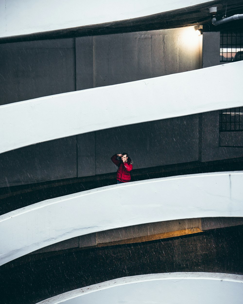 man standing on building rail