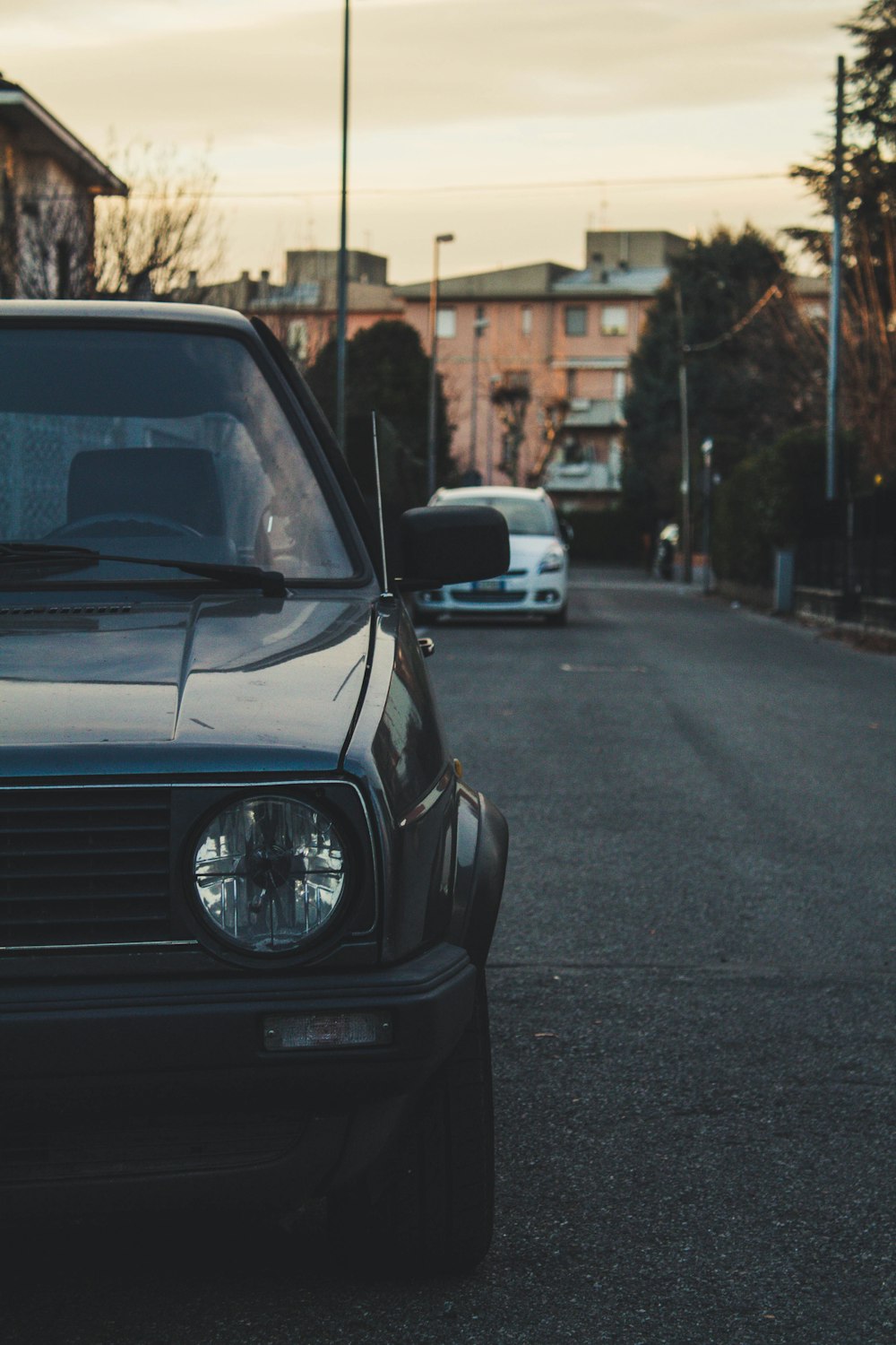 blue car parked near lamppost