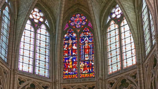 blue and red stained glass inside building in Meaux Cathedral France