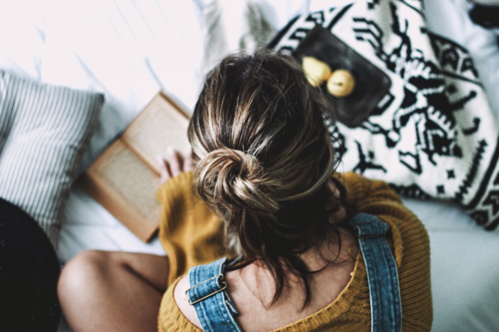 woman looking at book