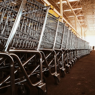 a row of shopping carts in a warehouse