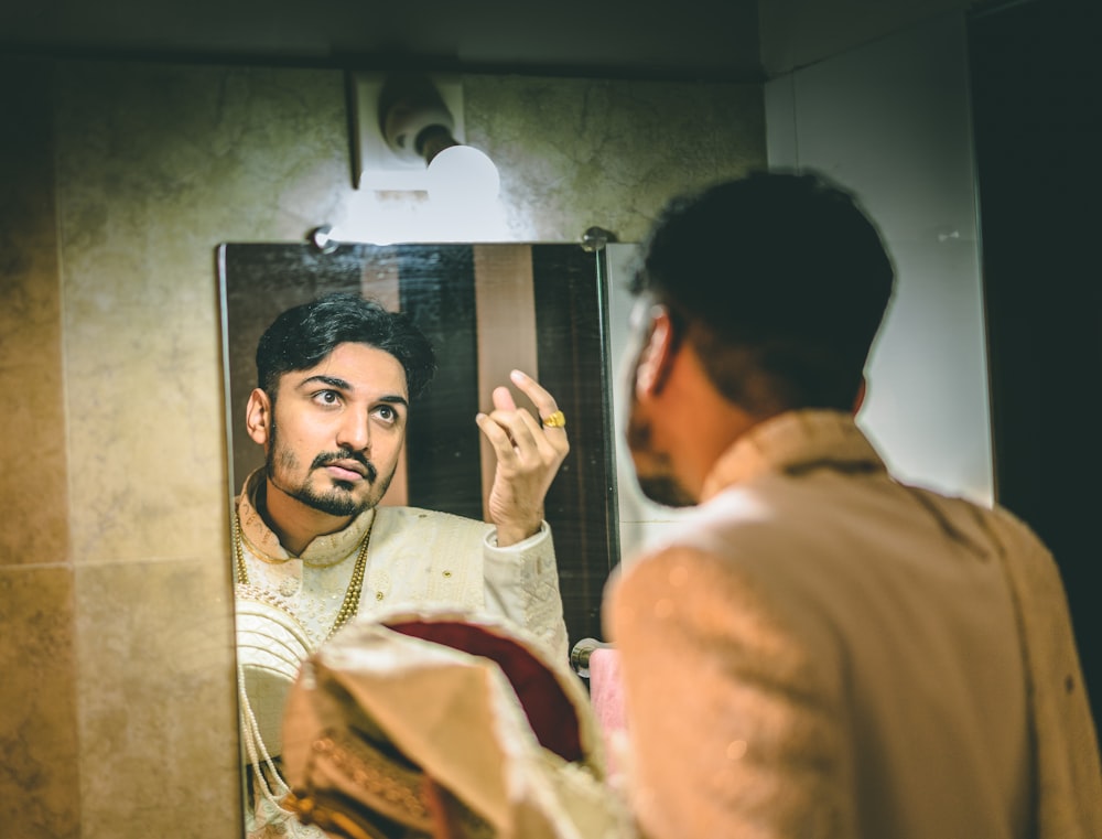 man facing at the mirror