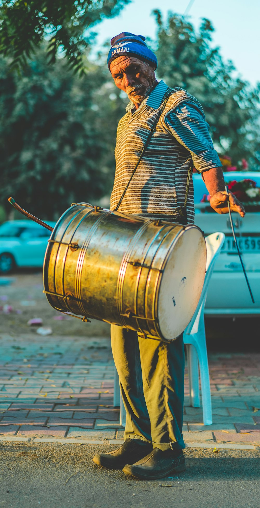 man carrying drum