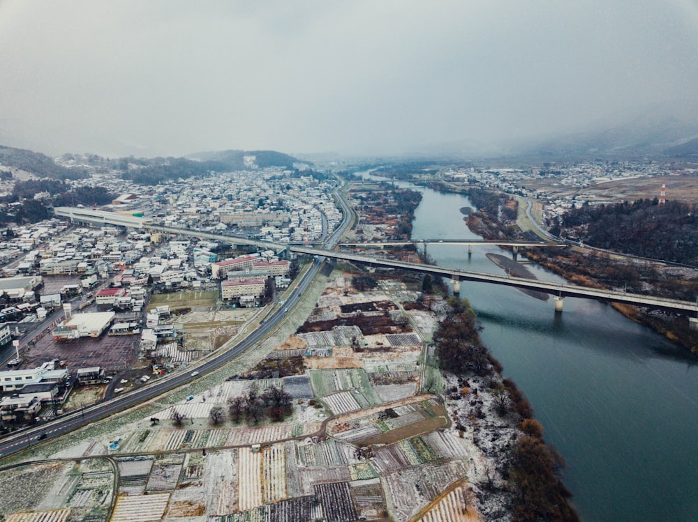 high-angle photography of cities and bridge