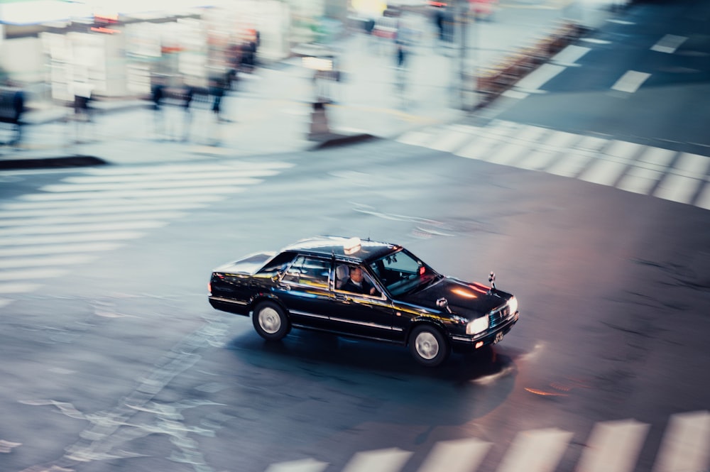 black sedan on intersection