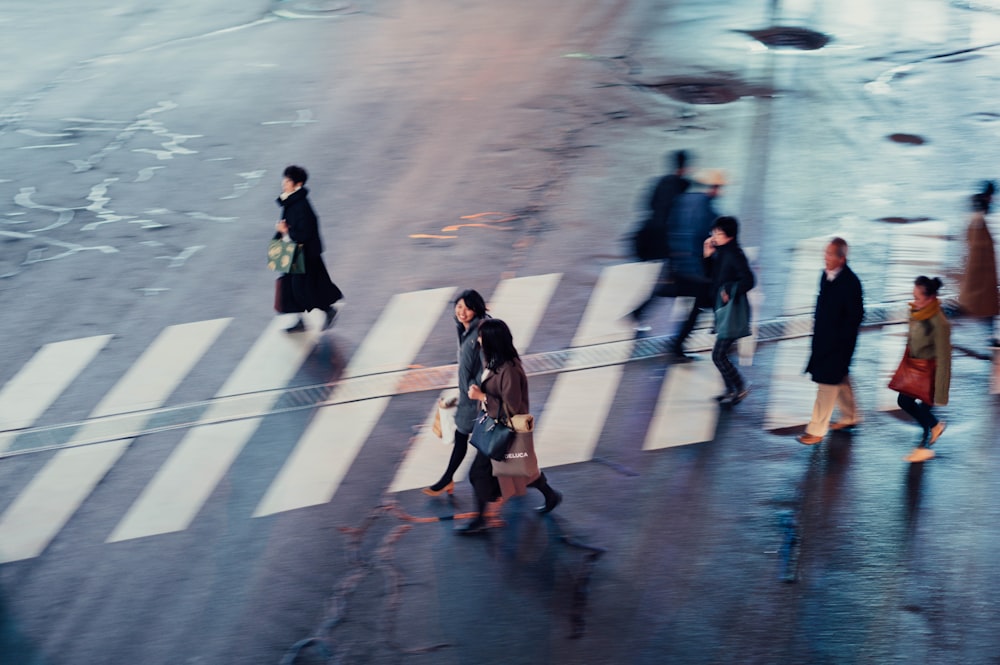 people walking on pedestrian lane