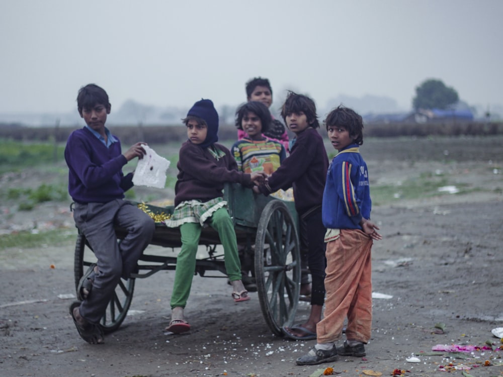 children standing by the bench