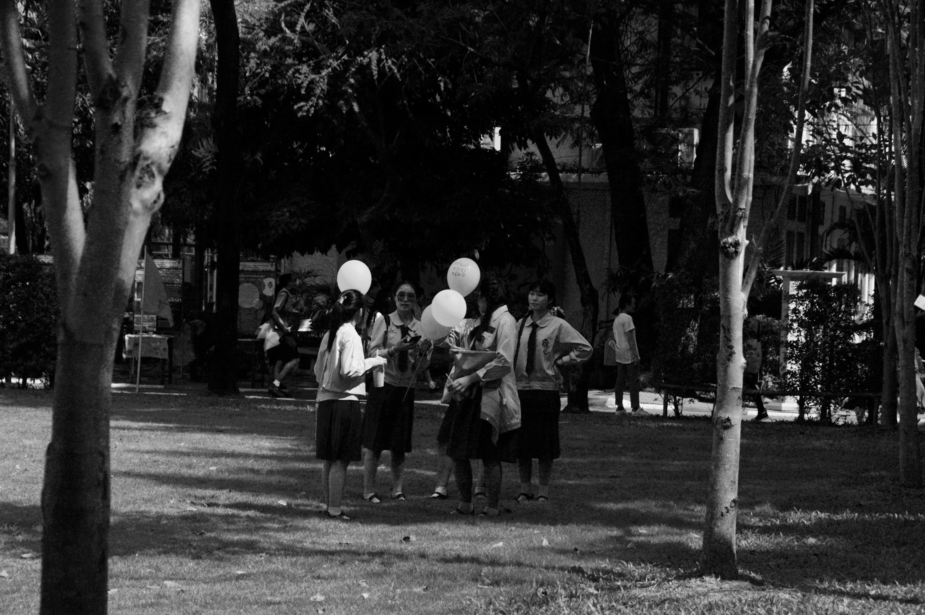 group of women holding balloons