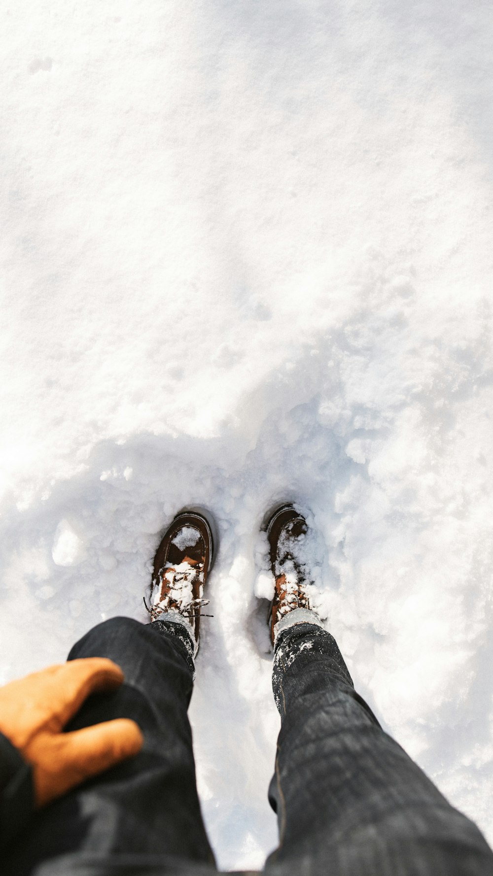 person standing on snow during daytime