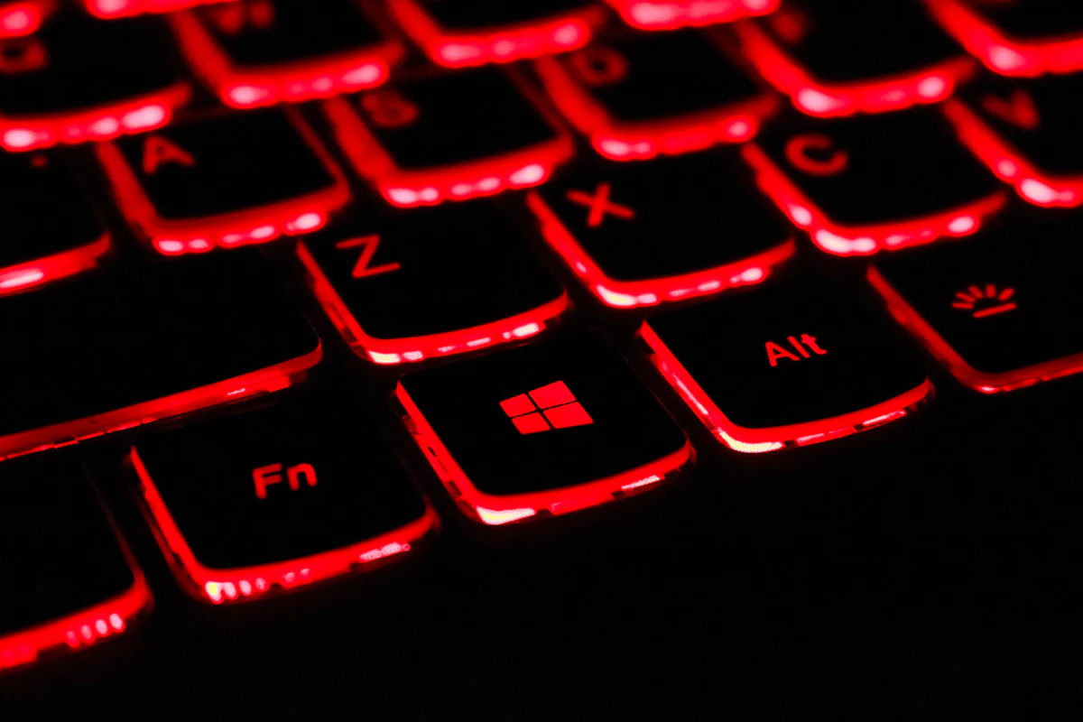 Close up of a red backlit gaming laptop keyboard — buying the wrong display resolution is a mistake that stays with you for the entire life of the machine