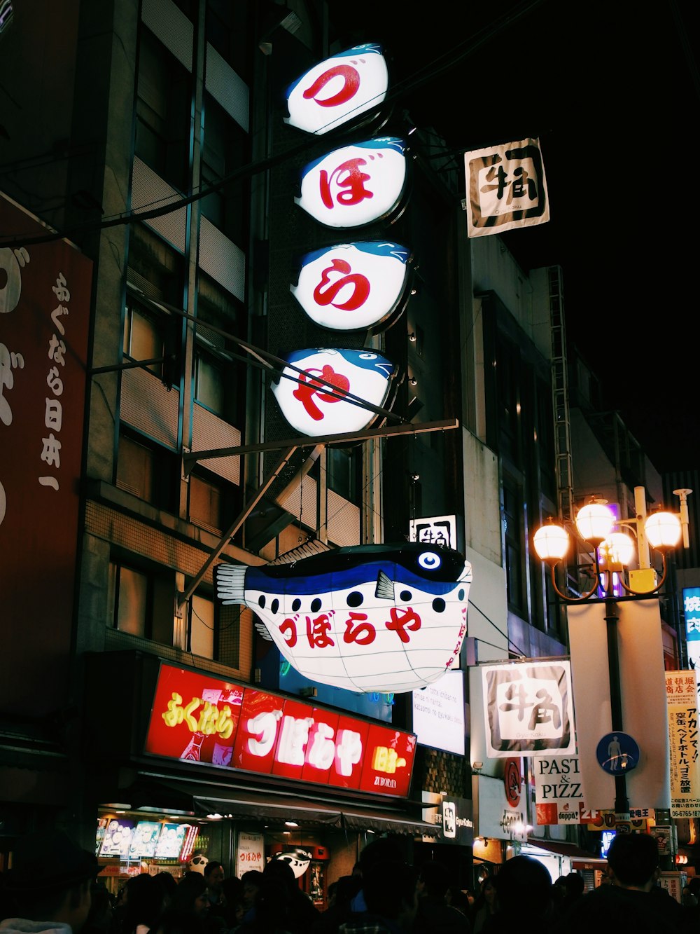 people in front of building during nighttime