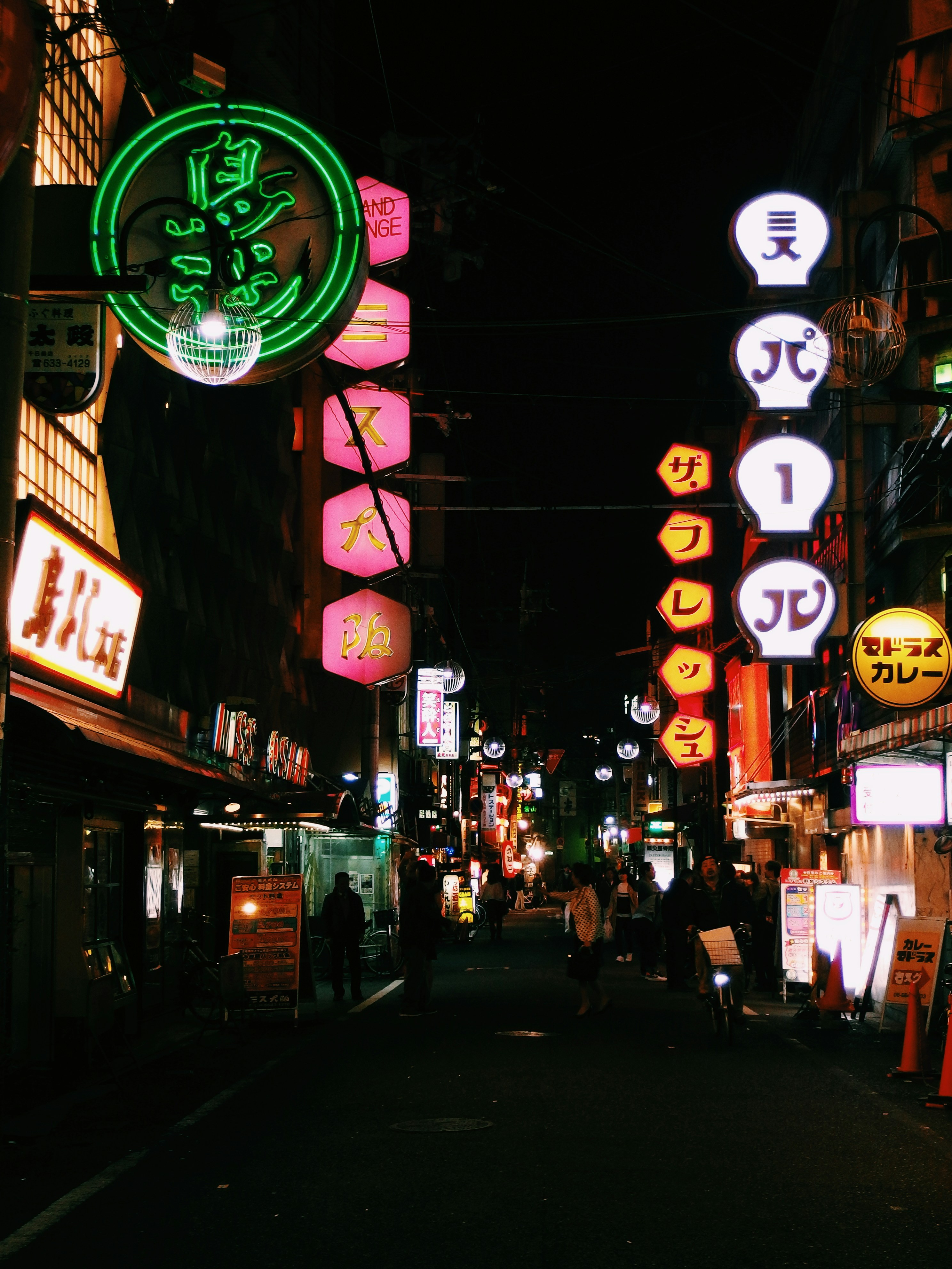 pathway in between buildings at night time