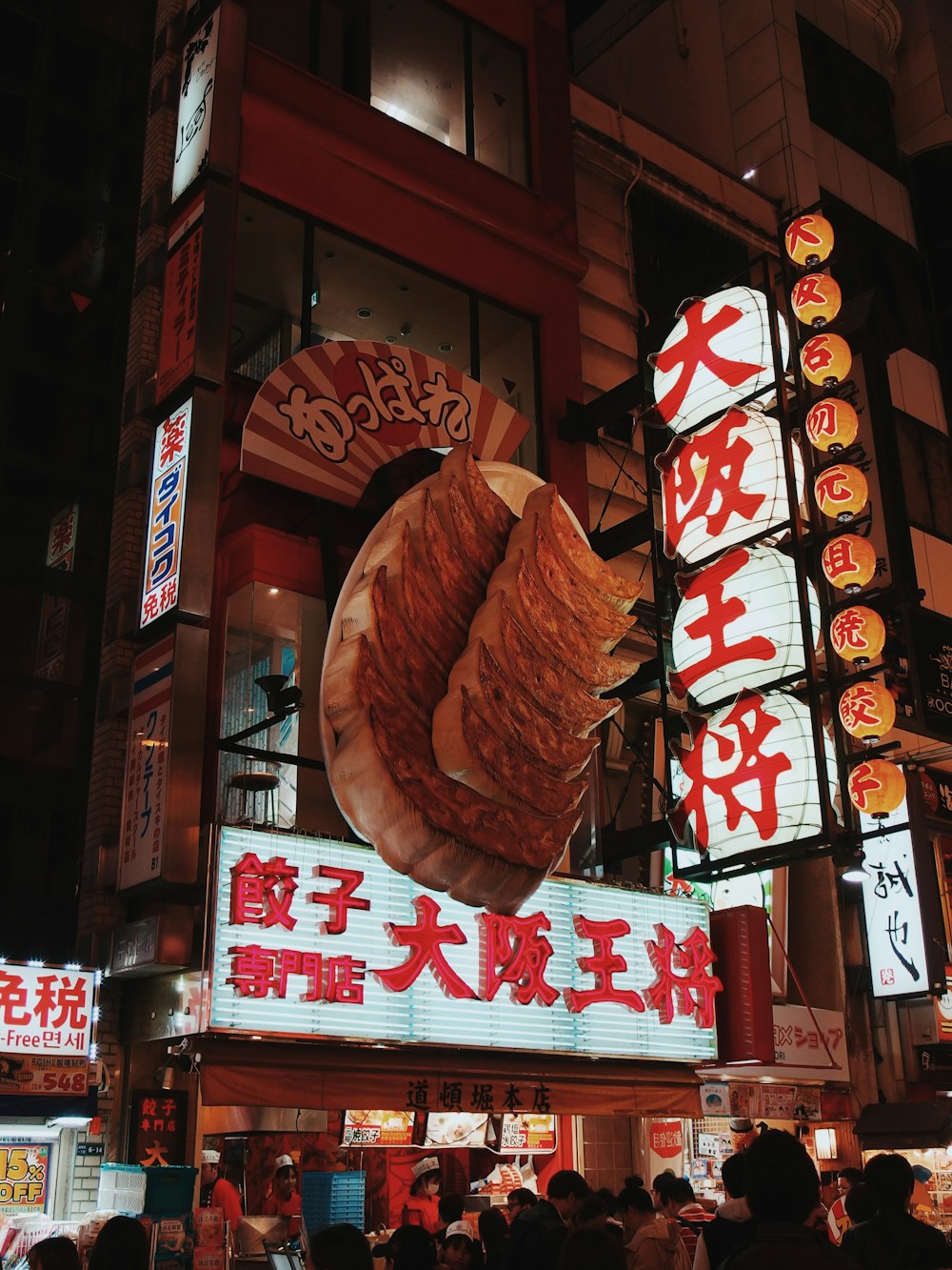 people near Chinese restaurant front signage during daytime