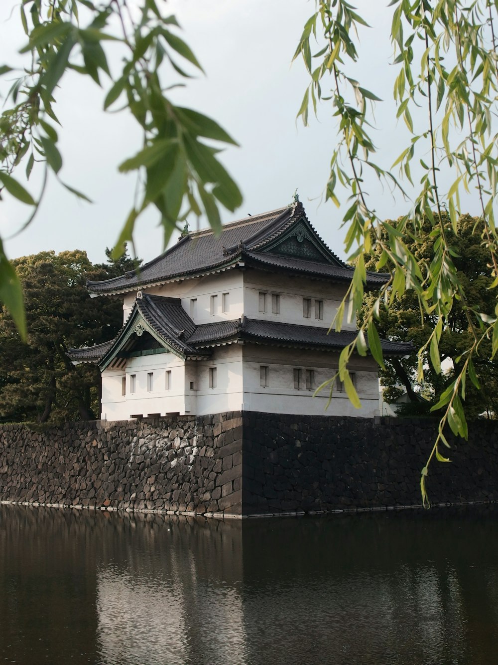 white and brown temple by the river