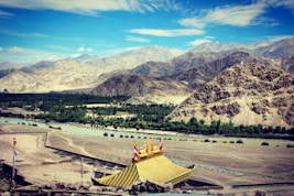 brown temple near mountain during daytime