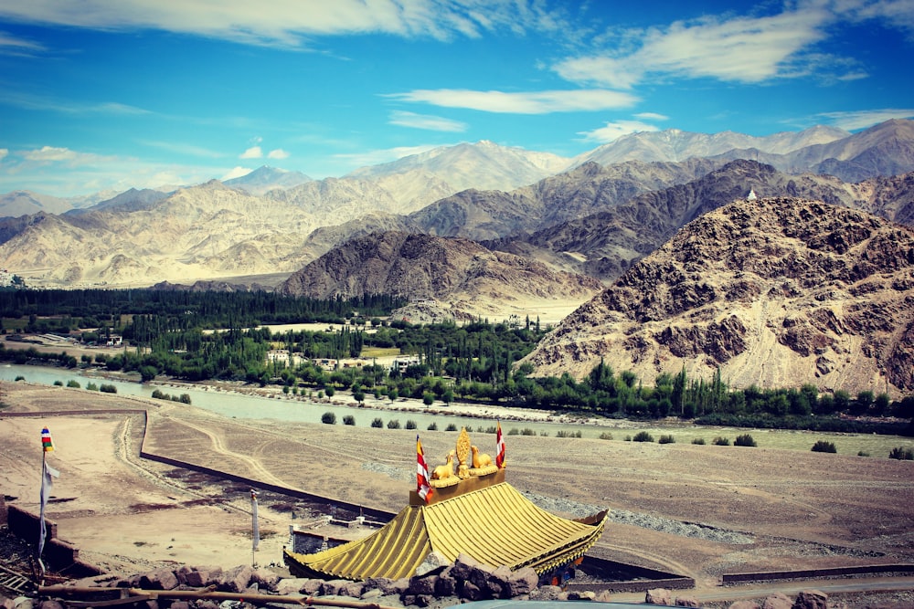 brown temple near mountain during daytime